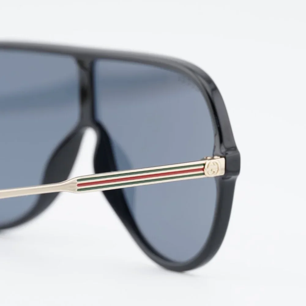 Gucci GG0199S 001 Sunglasses Shiny Black/Gold Shield Frame, Grey Lenses